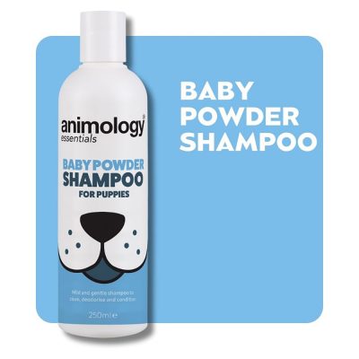 Bottle of Animology Baby Powder Shampoo on a baby blue background