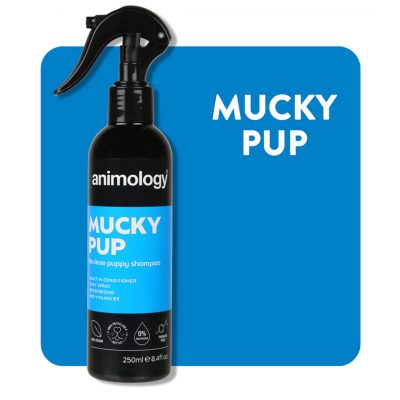 Bottle of Animology Mucky Pup no Rinse Shampoo spray on a blue background