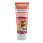 A single tube of Arden Grange Tasty Salmon Treat Premium Salmon Paste for dogs and cats, standing upright on a crisp white background. The salmon-pink and white tube displays graphics of a ginger tabby cat and a long-haired Rough Collie dog. The label indicates a naturally hypoallergenic, grain-free formula ideal for pet grooming rewards and masking tablets