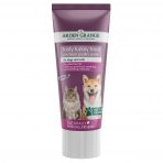 A single tube of Arden Grange Tasty Turkey Treat Premium Poultry Paste for dogs and cats, isolated on a white background. The deep purple and white packaging features images of a fluffy grey long-haired cat and a smiling Shiba Inu dog. The text outlines its grain-free, naturally hypoallergenic properties, serving as an excellent enrichment filler for lick mats and KONG toys from MAH Pet Supplies