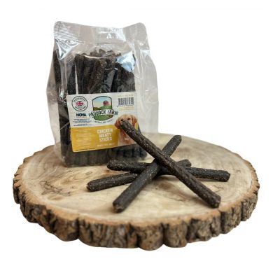 1kg pack of chicken flavoured sausages natural dog treats on a wooden display plate, with 4 loose sausages in front
