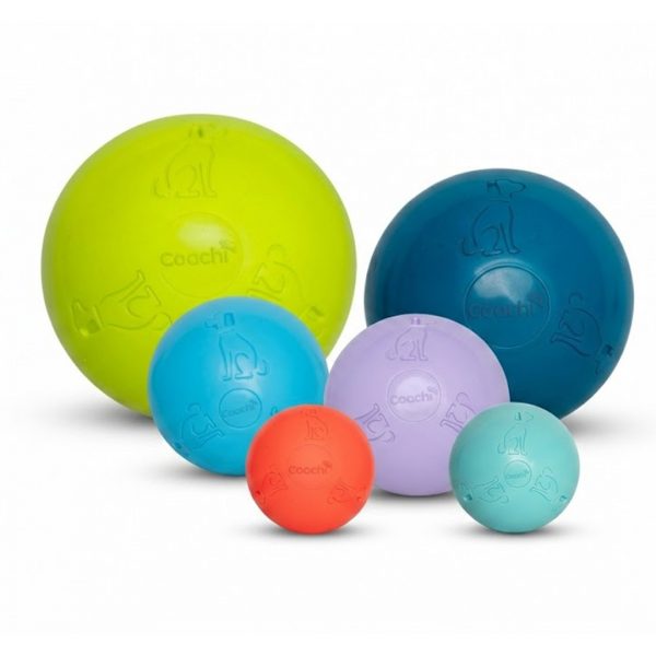 Coachi Boomi Ball Set 1080px Product studio shot showcasing the Coachi Boomi dog toy range against a clean, neutral white background. A collection of six Coachi Boomi virtually indestructible dog balls displayed in various sizes, vibrant modern colours, and a matte finish. The set features a large lime green ball, a large deep teal ball, a medium blue ball, a medium lilac ball, a small bright orange ball, and a small cool mint ball. Each ball is embossed with the Coachi brand name and distinctive dog silhouette logos.