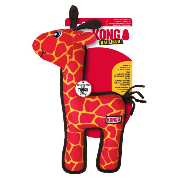 KONG Ballistic Giraffe on Card 1080px A product photograph of the KONG Ballistic Giraffe dog toy attached to its official retail packaging card, set against a plain white background. The white and red cardboard backing features the prominent brand logo "KONG Ballistic" and a circular graphic reading "Ripstop fabric for durable play" in multiple languages. A smaller circular tag attached to the neck reads "Reinforced for Tough Play". The brightly coloured red and yellow giraffe plush toy is mounted to the front, showcasing its heavy-duty stitched trim and durable design for retail display.
