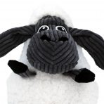 Close-up detailed shot focusing on the head and face of the KONG Sherps Floof Sheep plush dog toy. Shows the embroidered black eyes and small stitched smile on the grey fleece muzzle, highlighting the ultra-plush white fleece coat textures and neat, secure stitching details designed for safe interactive play