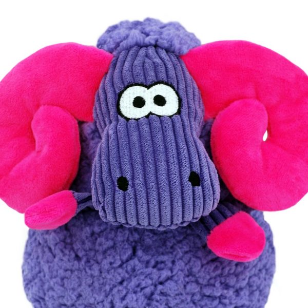 KONG Sherps Floofs Big Horn Close Up Face 1080px Close-up detailed shot focusing on the face of the KONG Sherps Floofs Big Horn plush dog toy. Shows the embroidered black eyes and stitched details on the pink fleece muzzle, highlighting the soft fabric textures and durable, high-quality stitching designed for safe indoor play and cuddling