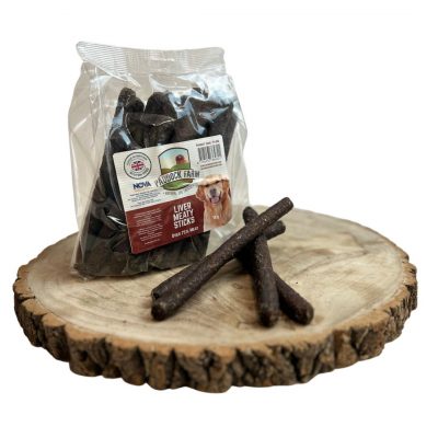 Bag of Liver meaty dog treat sausages, with 4 loose, on a wooden display plate