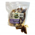Pack of Rabbit ears dog treats stuffed with ostrich meat, with some loose in front of the pack