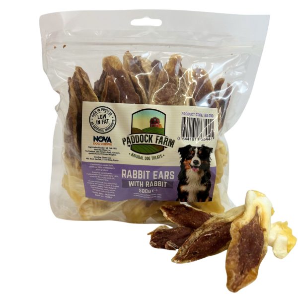 Pack of Rabbit ears dog treats stuffed with rabbit meat, with some loose in front of the pack