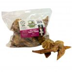 Product shot of 1kg Bag of Nova Dog Chews Paddock Farm Turkey Wings Natural Dog treats, with a couple of wings in front of the pack. All set on white background