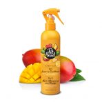 Orange Trigger spray bottle of Pet Head Ultimutt Conditioner in front of cut and whole Mangoes