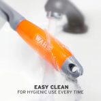 Close-up action shot of the orange and grey WAHL grooming comb handle being rinsed directly under a running water stream from a chrome tap to highlight its waterproof, low-maintenance design. Water droplets splash off the smooth, translucent orange surface. Bold text at the bottom reads "EASY CLEAN FOR HYGIENIC USE EVERY TIME"