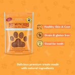 Pet Munchies Wild Salmon & Sweet Potato Sticks bag with icons for healthy skin and coat, grain and gluten free, and good for teeth